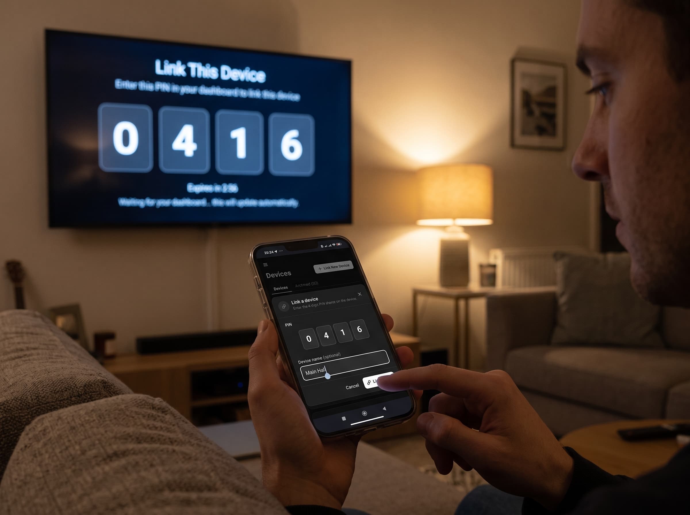 Hands linking a smart TV with a 4-digit pairing code on screen, phone in hand.